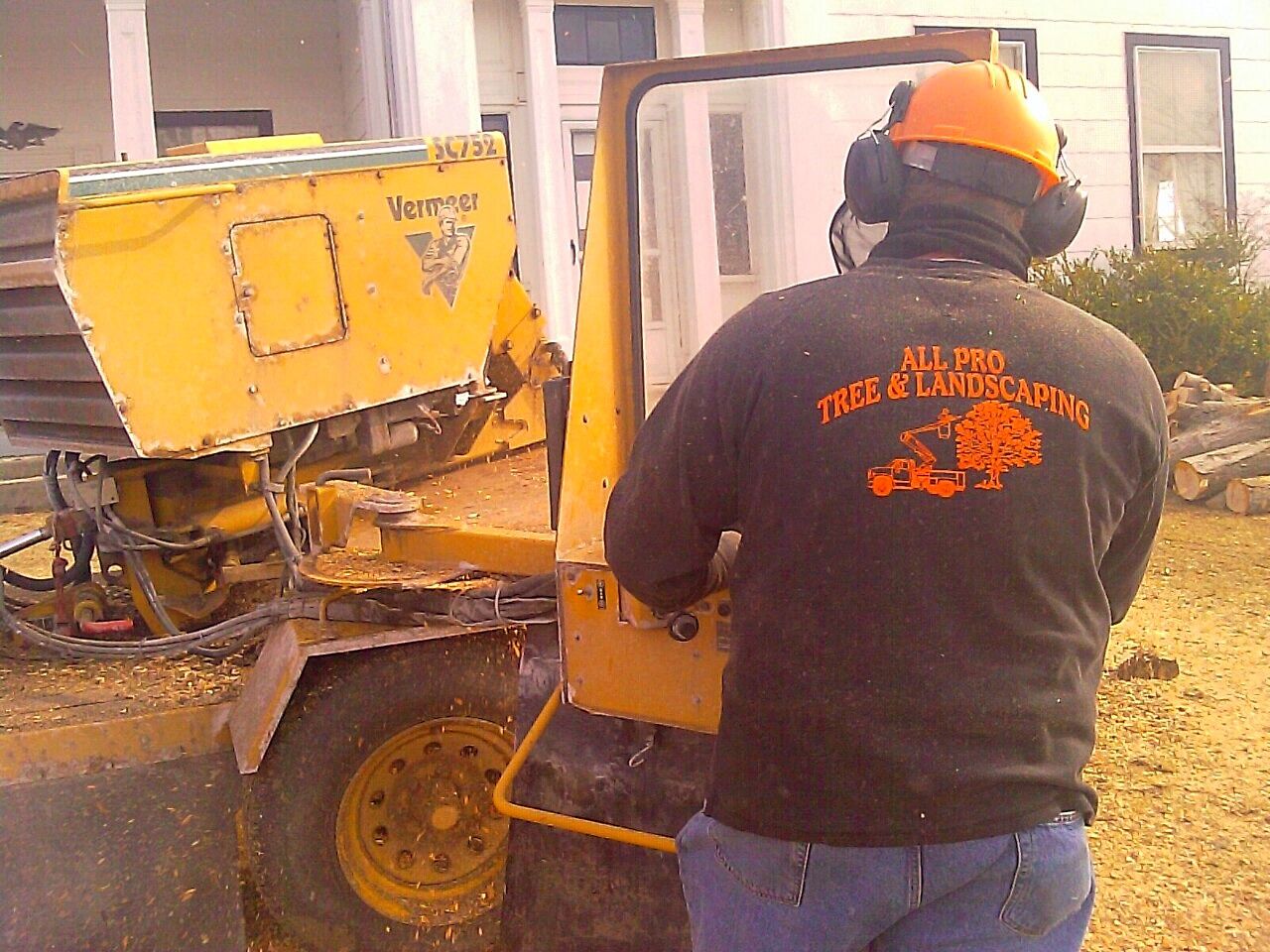 Owner Scott Drake using the stump grinder to remove a stump